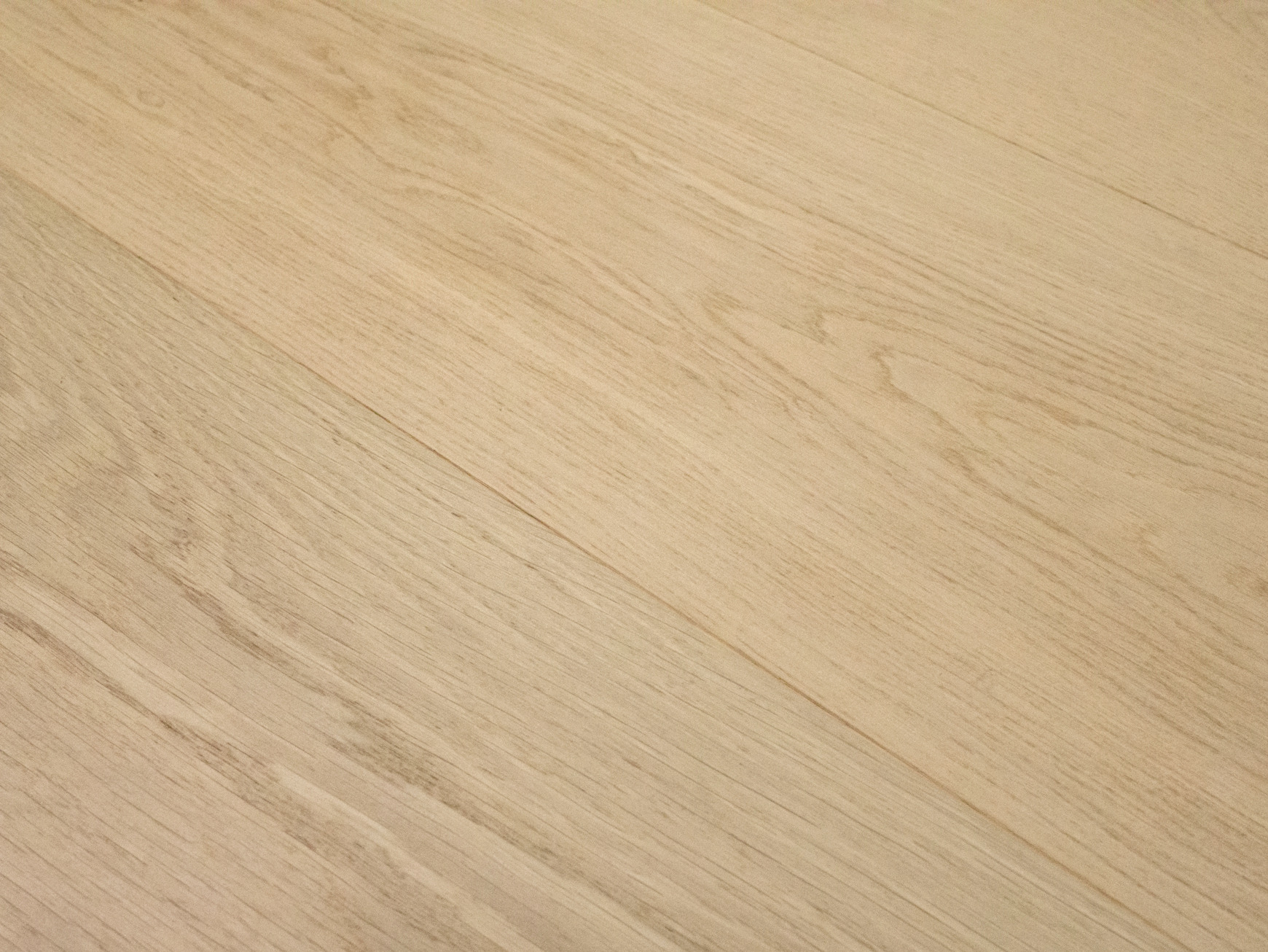 Pale, low-contrast plank angle shot with diagonal seams