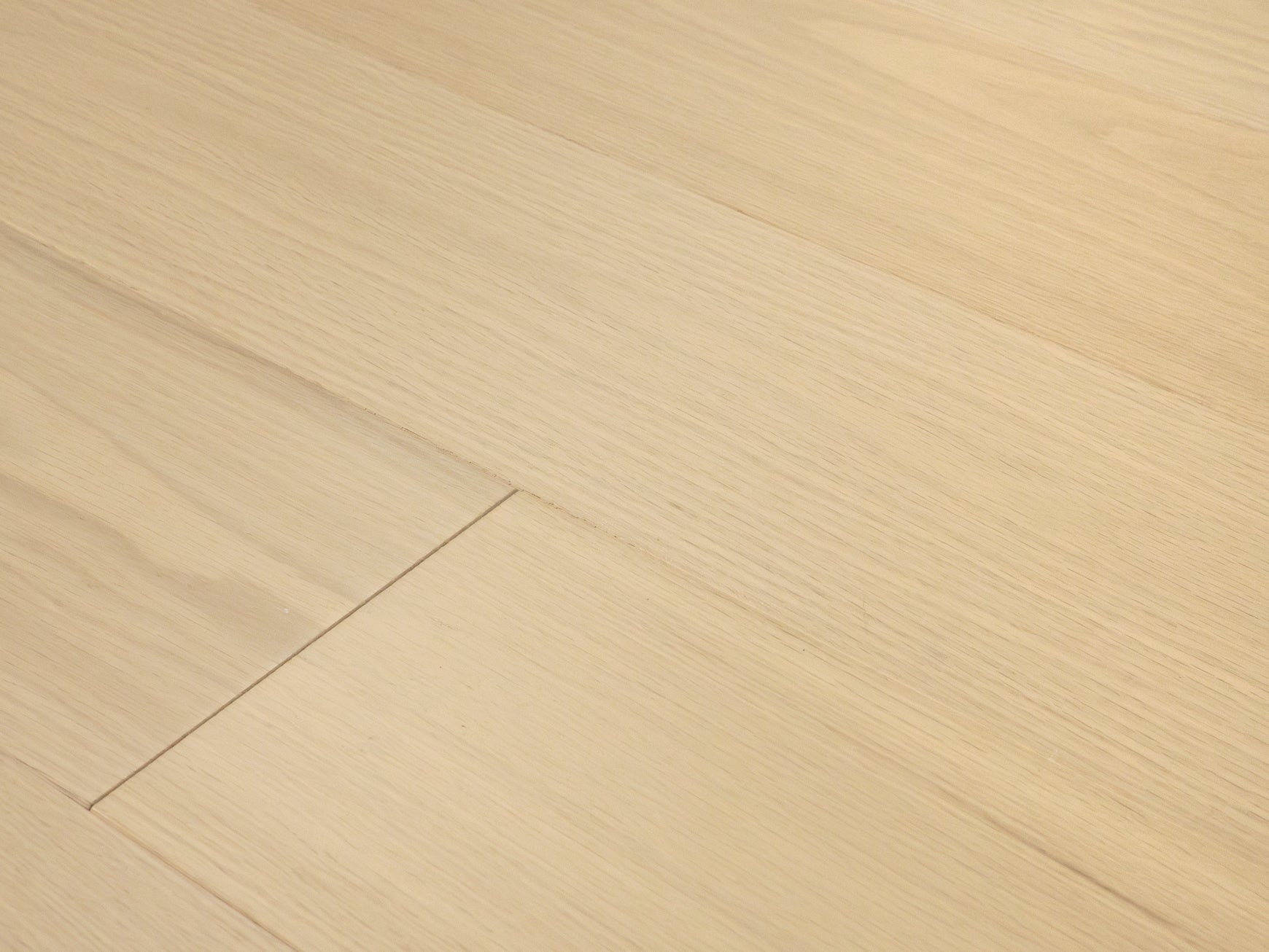 Pale, low-contrast oak planks at an angle with little visible texture