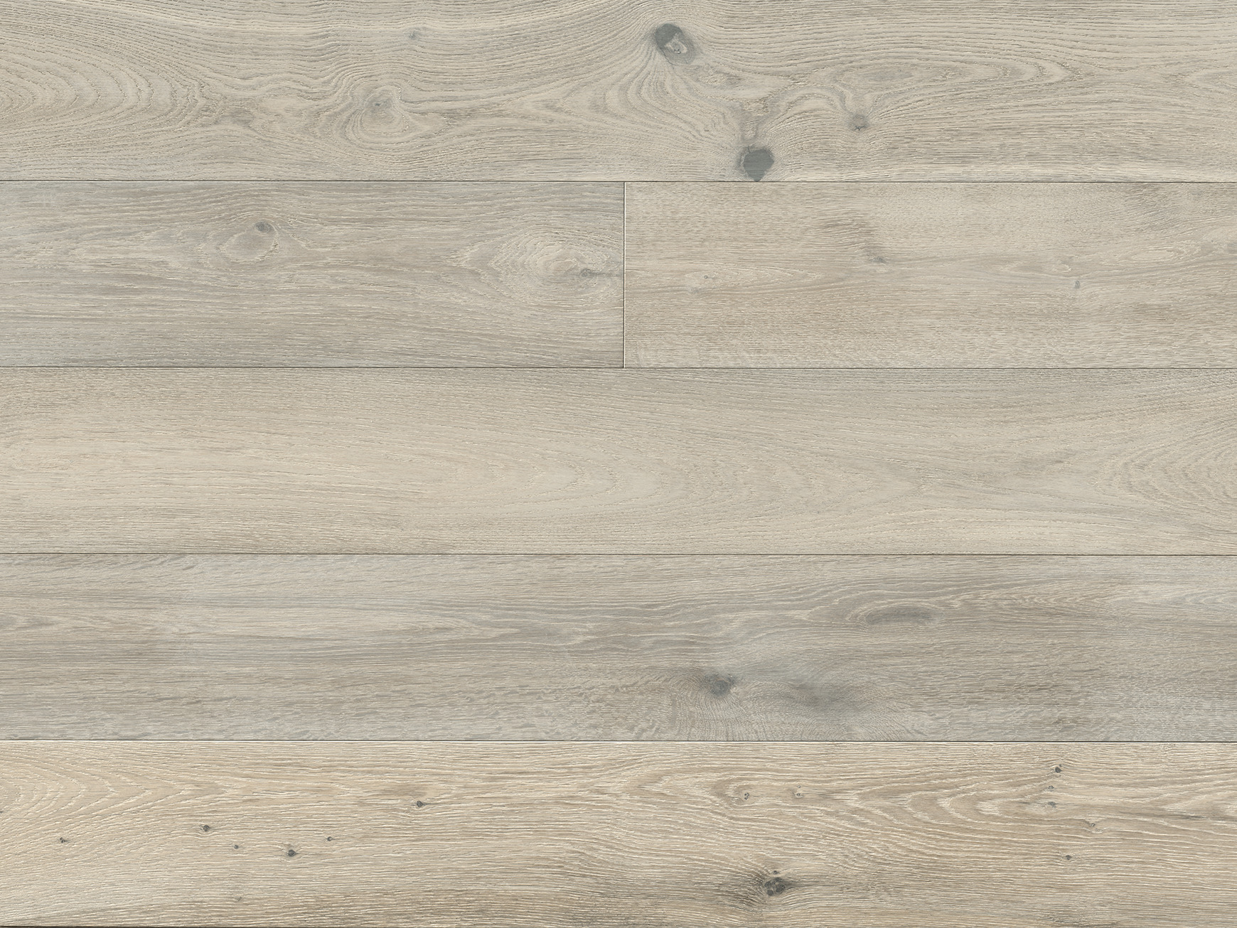 Top-down view of several oak planks side by side, with knots and variation between boards